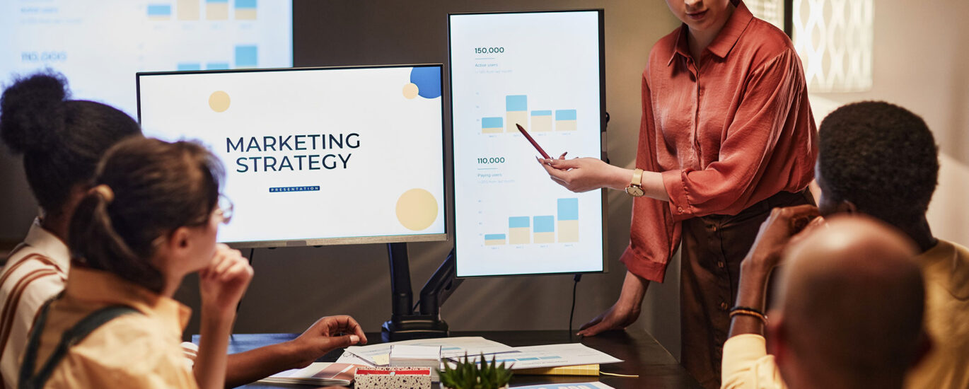 Link Launch Studio team collaborating on a data-driven digital marketing strategy during a business presentation.