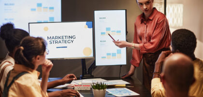 Link Launch Studio team collaborating on a data-driven digital marketing strategy during a business presentation.