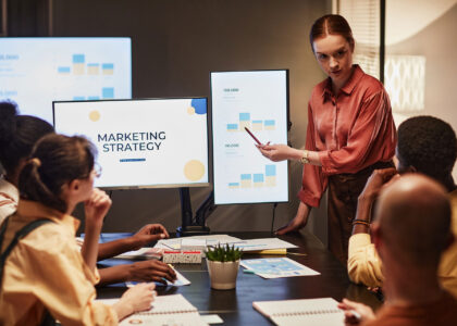 Link Launch Studio team collaborating on a data-driven digital marketing strategy during a business presentation.