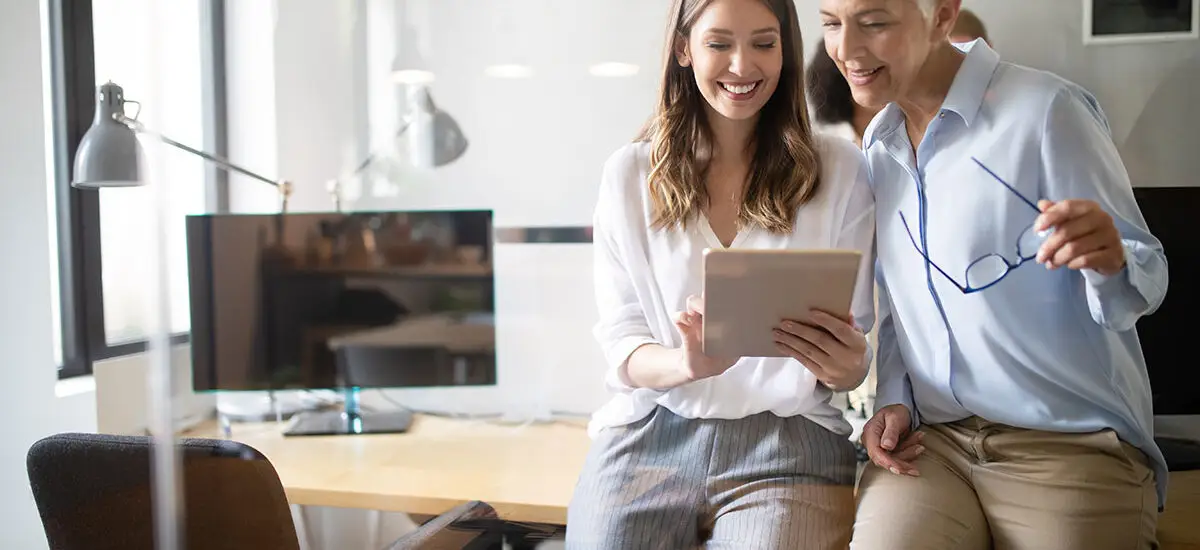 Link Launch Studio consultants analyzing social media marketing growth metrics and modern digital business strategies on a table