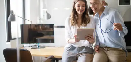 Link Launch Studio consultants analyzing social media marketing growth metrics and modern digital business strategies on a table